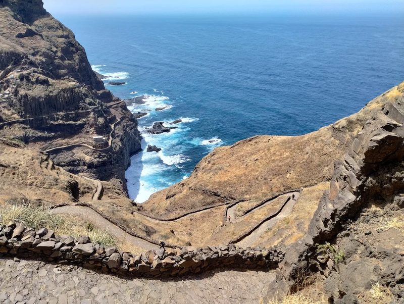 Stone-walled zigzag path above a rocky sea inlet on the north coast of Santo Antão
